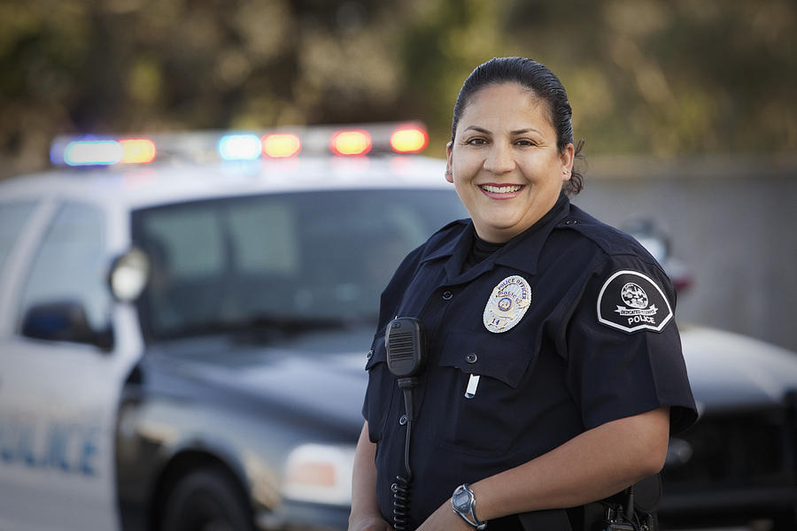 Hispanic policewoman Photograph by Hill Street Studios