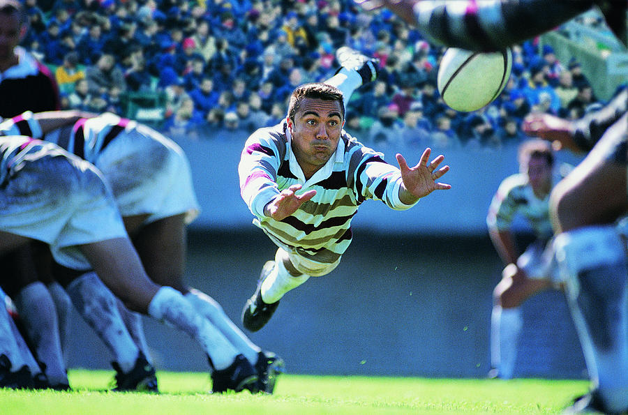 Hispanic Rugby Union Player Jumping To Catch The Ball Photograph by Flying Colours Ltd