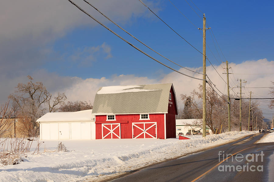 Historic red barn on a snowy winter day Photograph by Louise Heusinkveld
