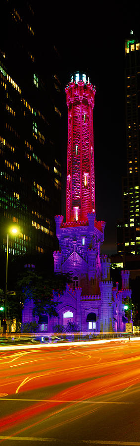 Architecture Photograph - Historic Water Tower Lit Up At Night by Panoramic Images