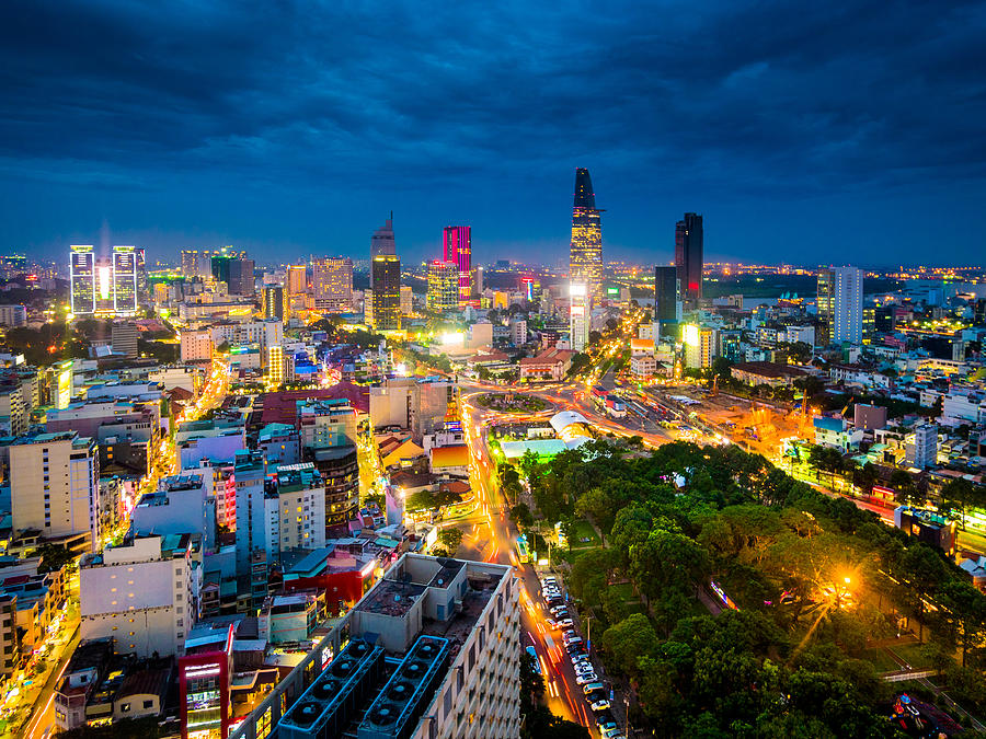 Ho Chi Minh City in Vietnam at night Photograph by Holgs