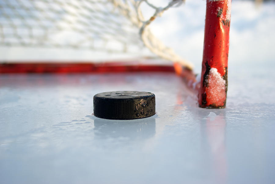 Hockey Net and Puck Photograph by SimplyCreativePhotography