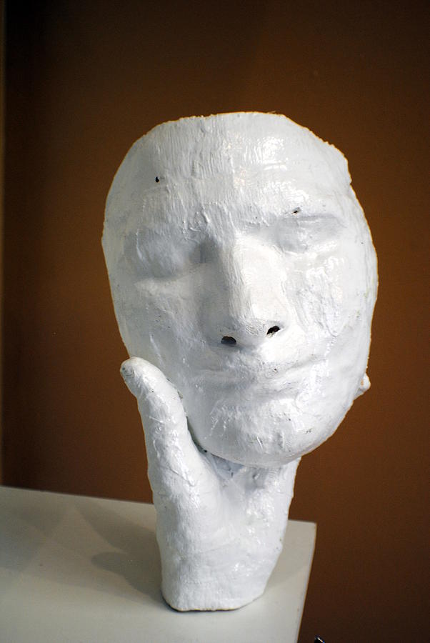 Face Sculpture - Holding onto his facade by Meganne Peck