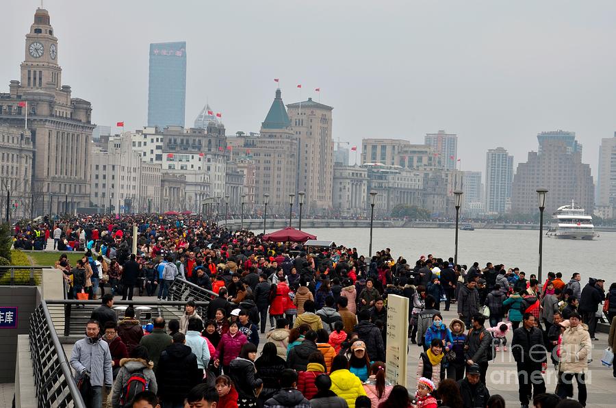 Holiday crowds throng the Bund in Shanghai China Photograph by Imran Ahmed