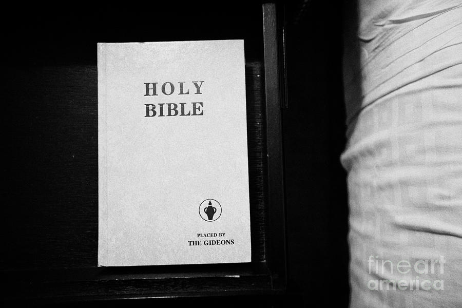 Book Photograph - holy bible left by the gideons in a drawer at the side of the bed in a hotel room in Las Vegas Nevad by Joe Fox