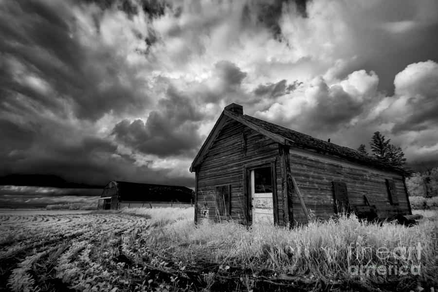 Homestead under stormy sky Photograph by Dan Jurak