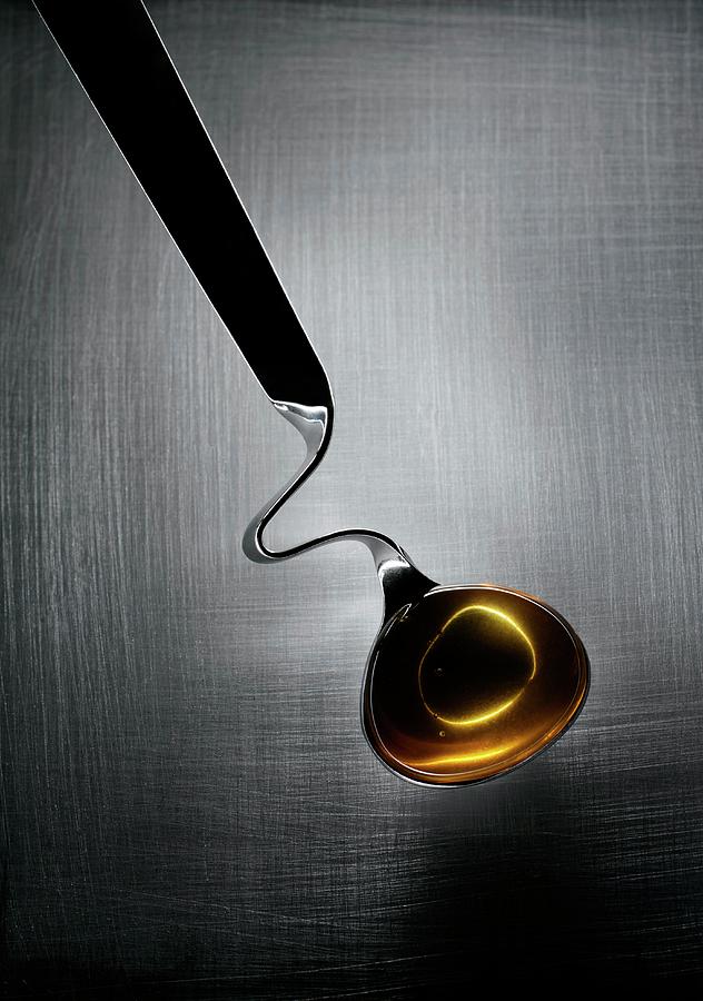 Honey In A Honey Spoon Photograph by Patrick Llewelyn-davies/science Photo Library