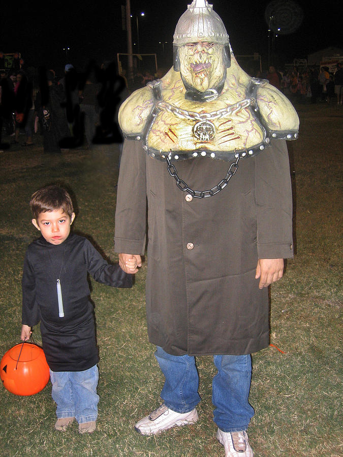 Hooded man and son celebrate Halloween in Casa Grande Arizona 2005 Photograph by David Lee Guss