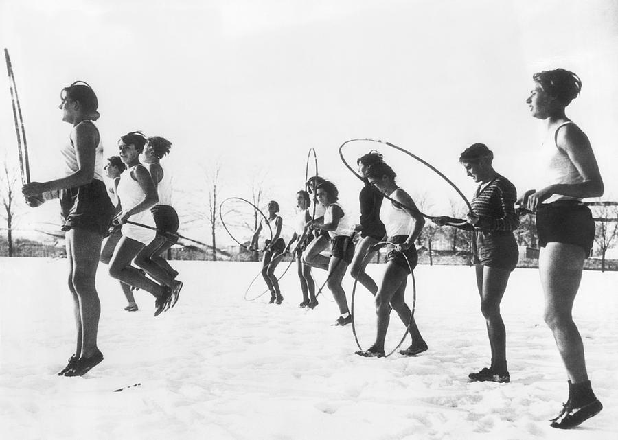 Hoop Jumping Schoolgirls Photograph by Underwood Archives