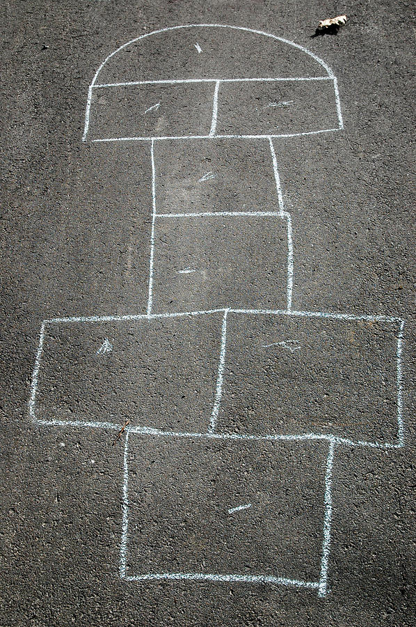 Hopscotch game outline drawn in chalk on driveway Photograph by Rob Huntley