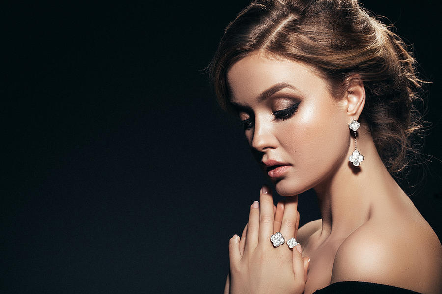 Horizontal portrait of a beautiful girl with shiny jewelry Photograph by CoffeeAndMilk