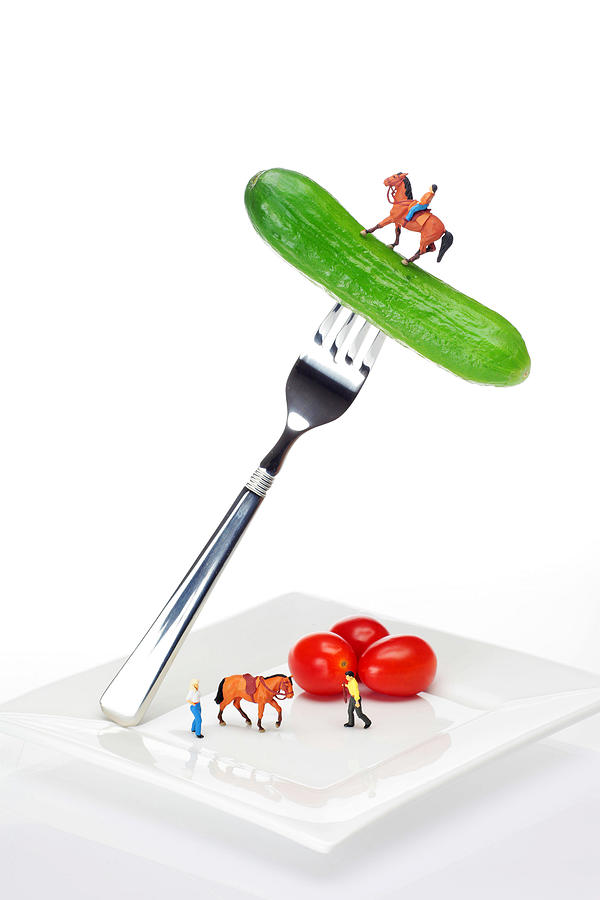 Horse riding on cucumber little people on food Photograph by Paul Ge