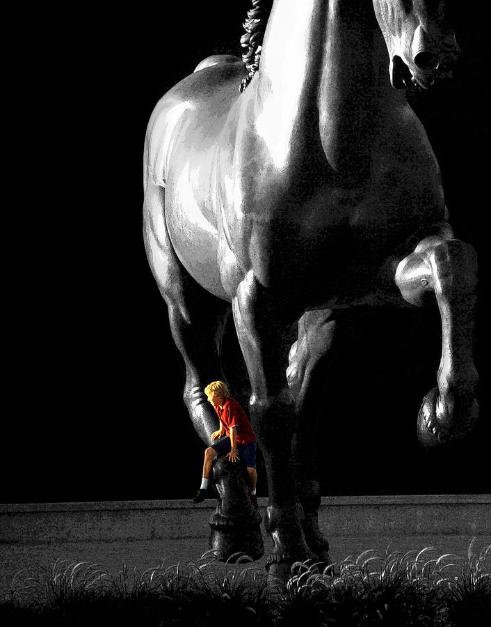 Horse Sculpture with a Boy Dressed in Red Photograph by Randall Nyhof