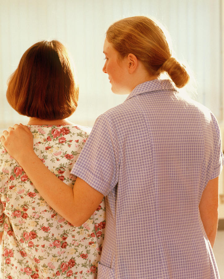 Nurse Photograph - Hospital Nurse Comforts A Female Patient by Ruth Jenkinson/midirs/science Photo Library