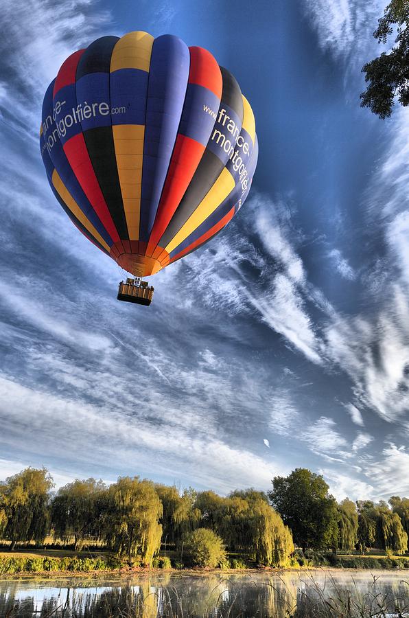 Hot air balloon in a vivid blue sky Photograph by Mick Flynn