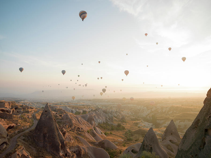 Hot Air Balloons Rise Above Desert Photograph by Ascent Xmedia