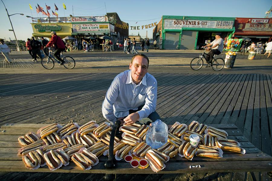 Hot Dog Eating Champion Photograph by Peter Menzel/science Photo Library