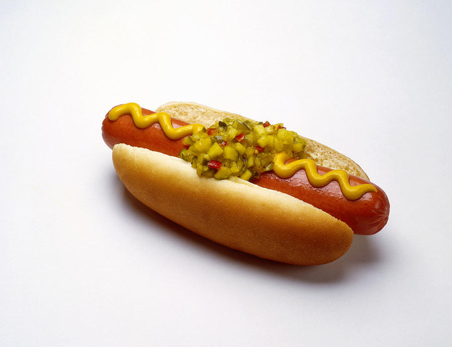 Hot dog with mustard and relish Photograph by Burke/Triolo Productions