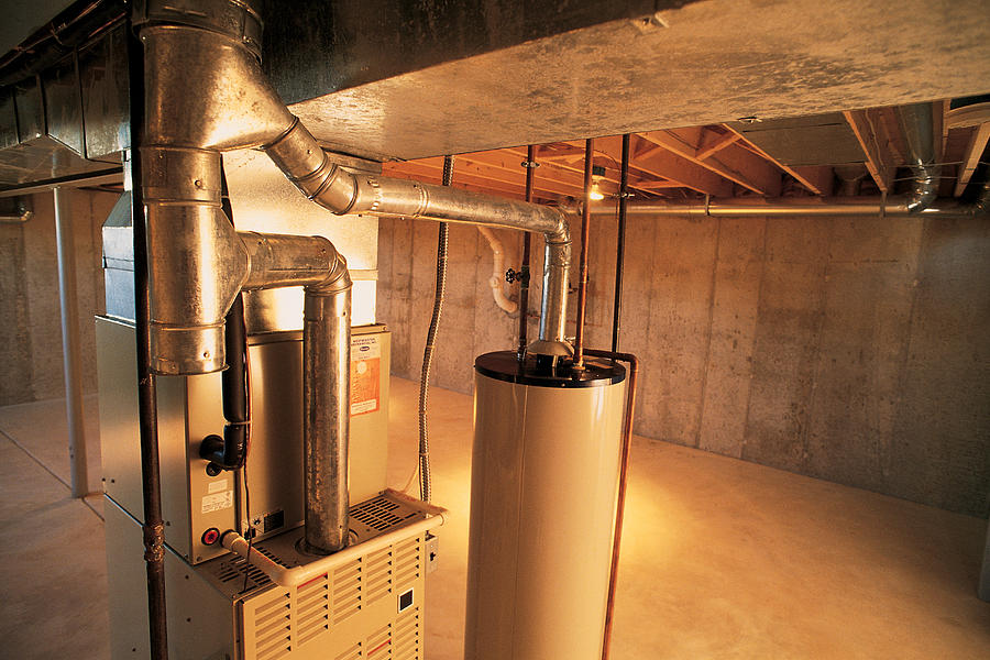 Hot water heater , gas furnace and air conditioning unit Photograph by Comstock