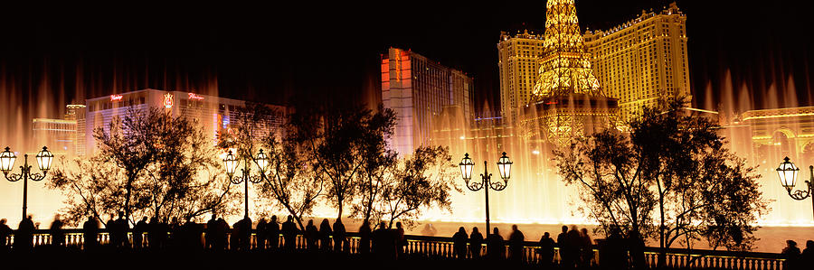 Las Vegas Photograph - Hotels In A City Lit Up At Night, The by Panoramic Images