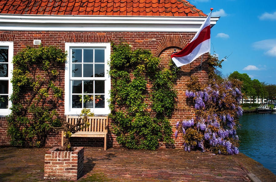 House on the Canal Shore. Brielle. Netherlands Photograph by Jenny Rainbow