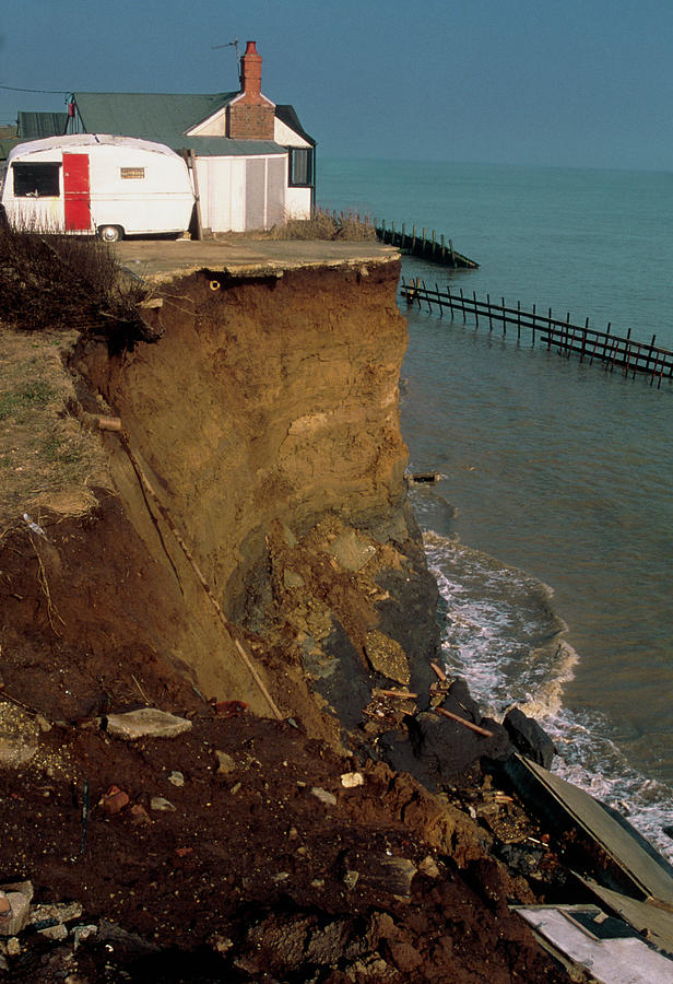 House Perched At The Top Of A Sea Eroded Cliff Photograph by Graeme Ewens/science Photo Library