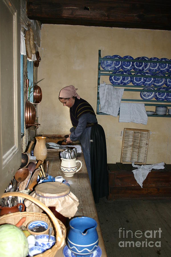 Housewife in old kitchen Photograph by Susanne Baumann