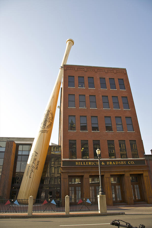 Huge bat leaning against five-story building Photograph by Barry Winiker