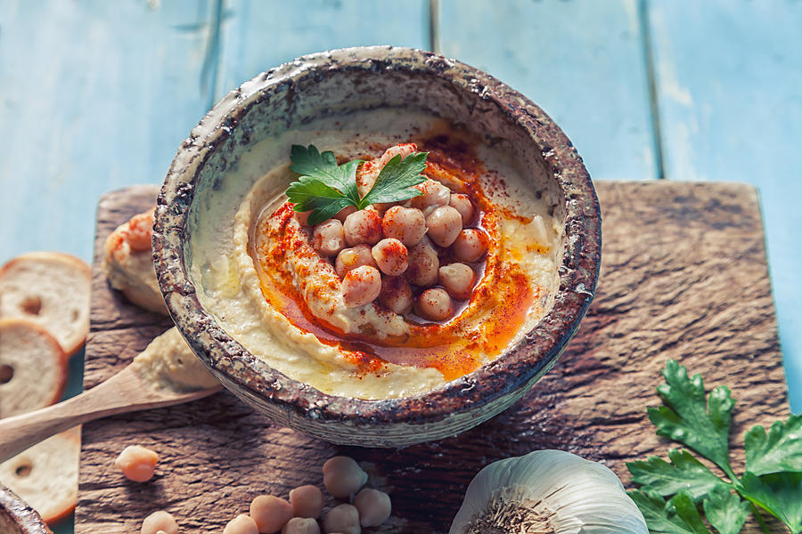 Hummus topped with whole chickpeas and olive oil. Photograph by Maika 777