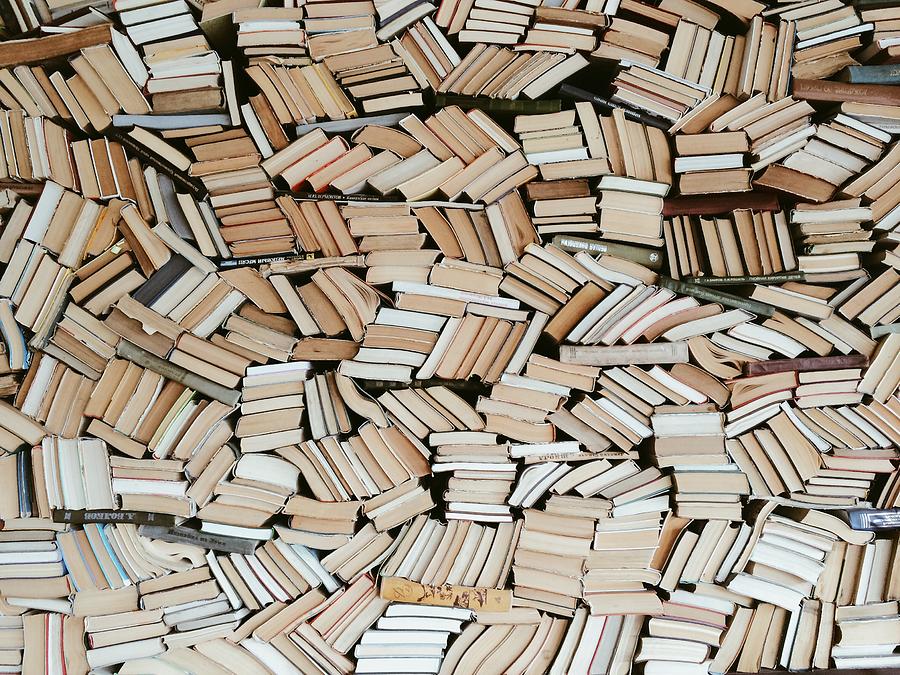 Hundreds of books in chaotic order Photograph by Alexander Spatari