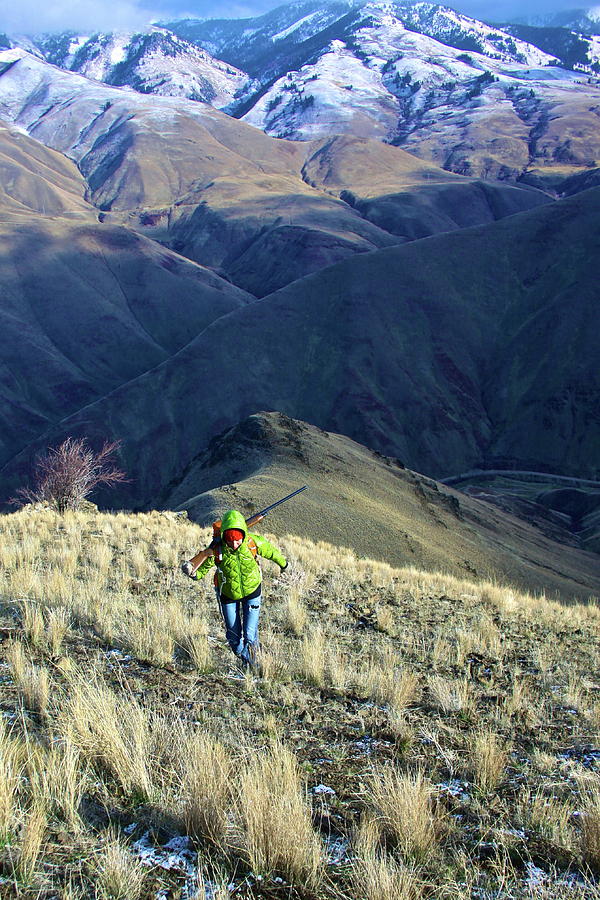 Hunter Climbing Steep Hillside Photograph by Jillian Lukiwski