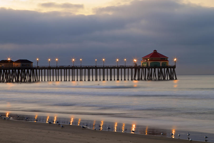 Huntington Beach pier morning lights Photograph by Duncan Selby