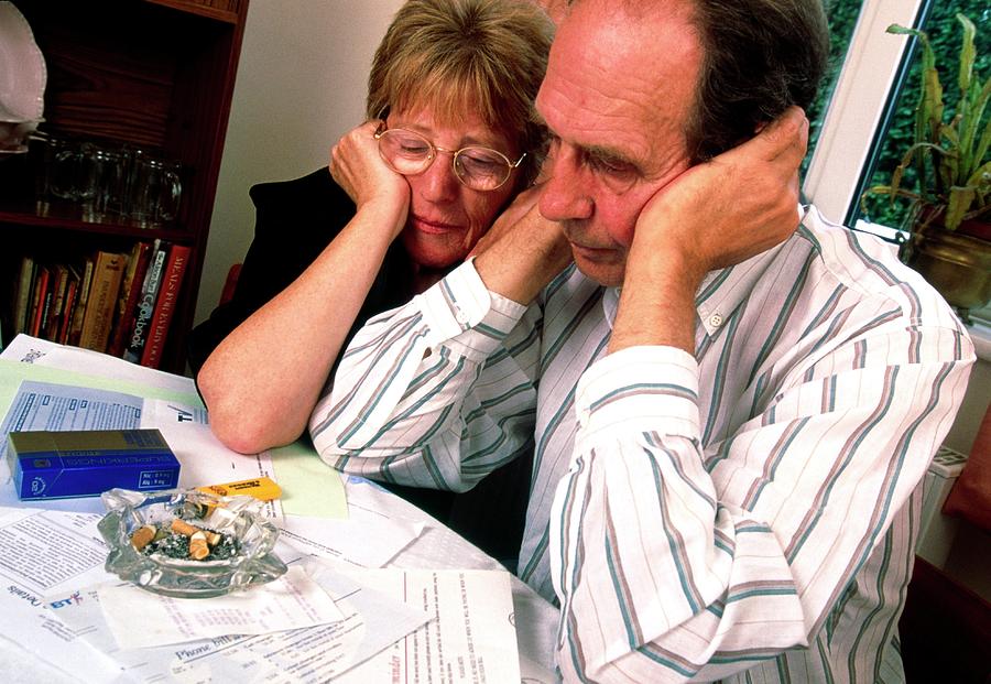 Husband And Wife Depressed Over Financial Worries Photograph by Jim Varney/science Photo Library