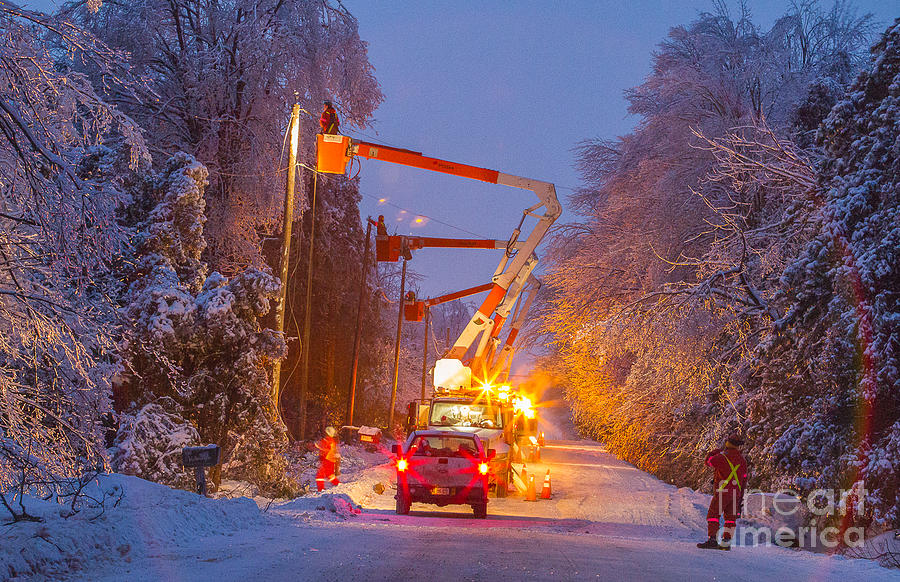 Hydro one workers in the ice storm  Photograph by Simon Jones