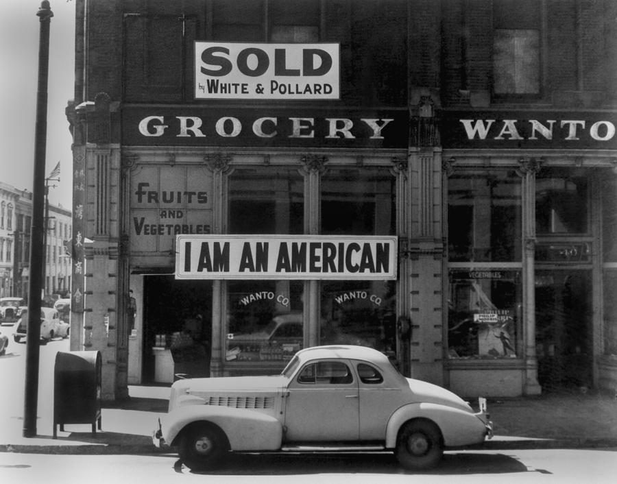 I Am An American Sign On A Store Front Photograph by Everett