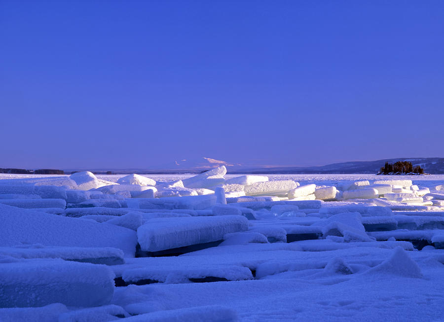 Ice cubes floating on lake Photograph by Sasas Photography | Pixels