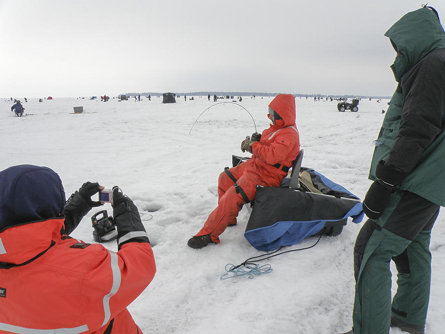 Ice fishing Photograph by Nick Mares