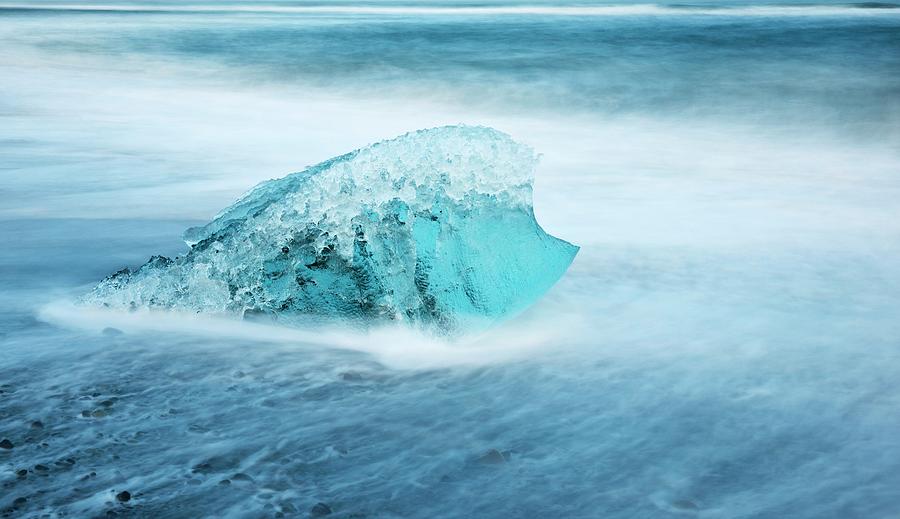Iceberg Melting On A Beach Photograph by Jeremy Walker