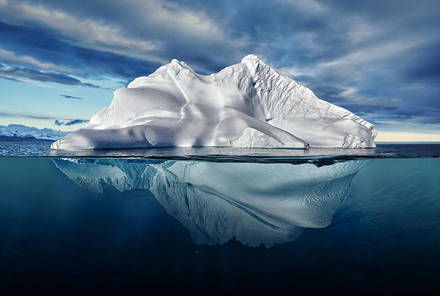 Iceberg With Above And Underwater View Taken In Greenland. Photograph by Posteriori