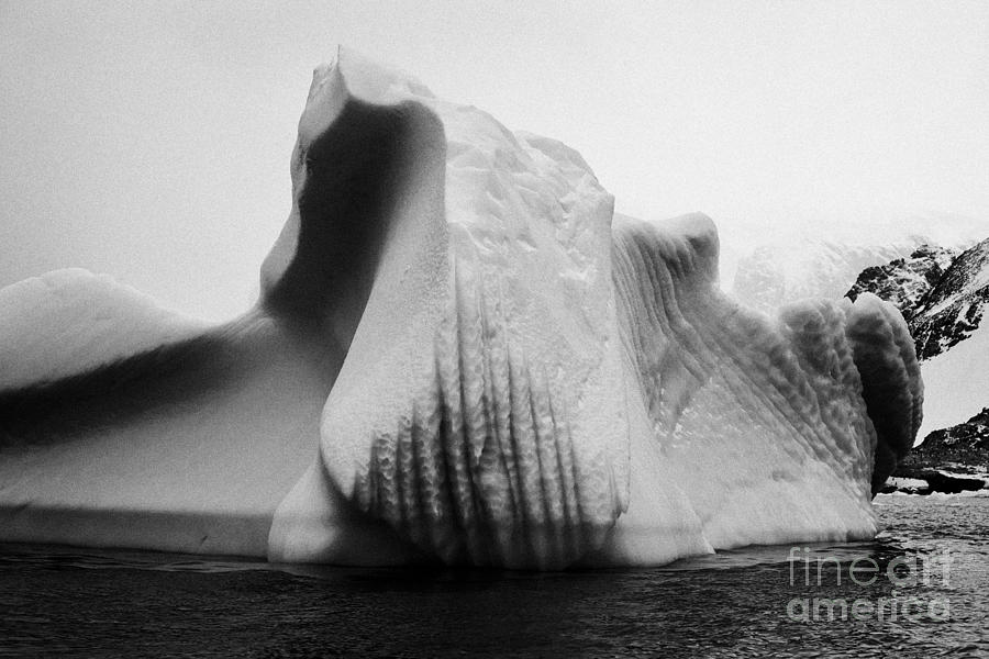 iceberg with line markings and waterline erosion near cuverville island ...