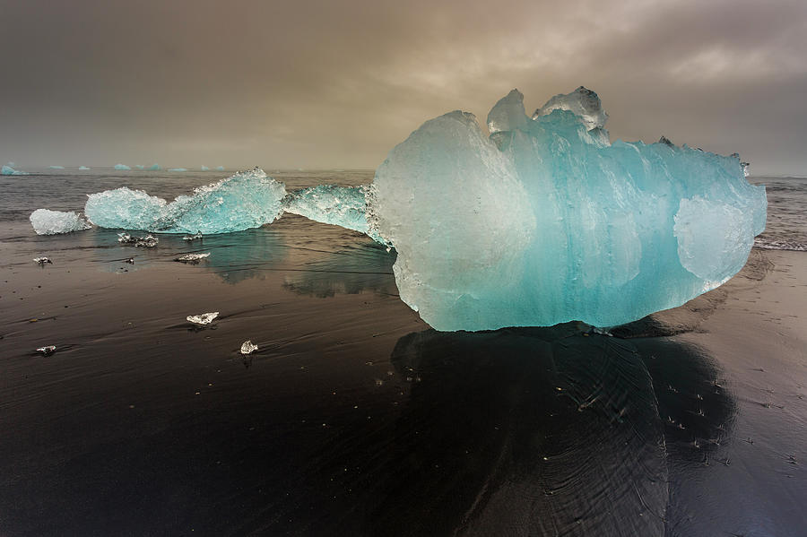 Icebergs On The Beach - Iceland Photograph by Gavriel Jecan