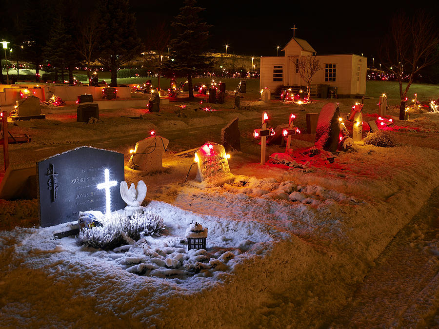 Iceland, Hafnarfjordur, cemetery decorated with Christmas lights Photograph by Arctic-Images