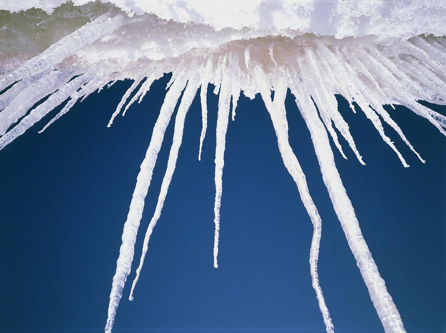 Icicles Hanging Off Snow Covered Rock Photograph By Simon Fraser Science Photo Library