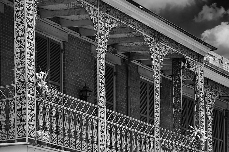 Iconic New Orleans wrought iron balcony Photograph by Alexandra Till