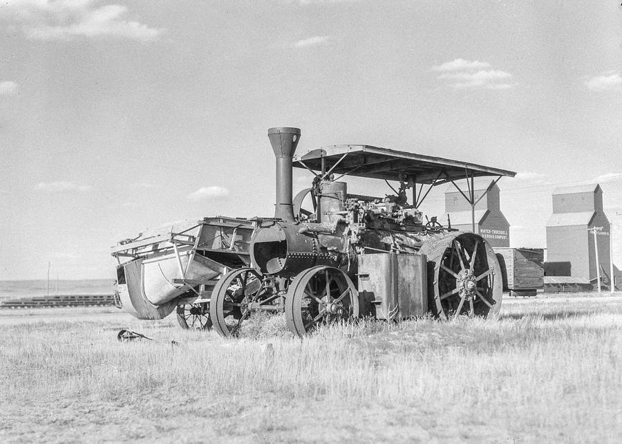 Vintage Photograph - Idle threshing with empty elevators in the background by Days Gone By
