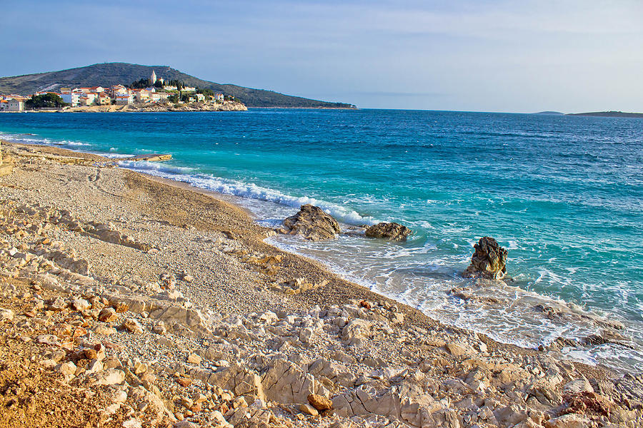 Idyllic beach and Town of Primosten Photograph by Brch Photography