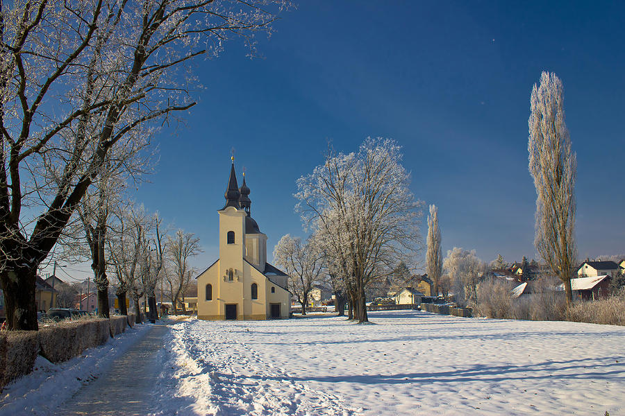 Idyllic winter Church in snow Photograph by Brch Photography