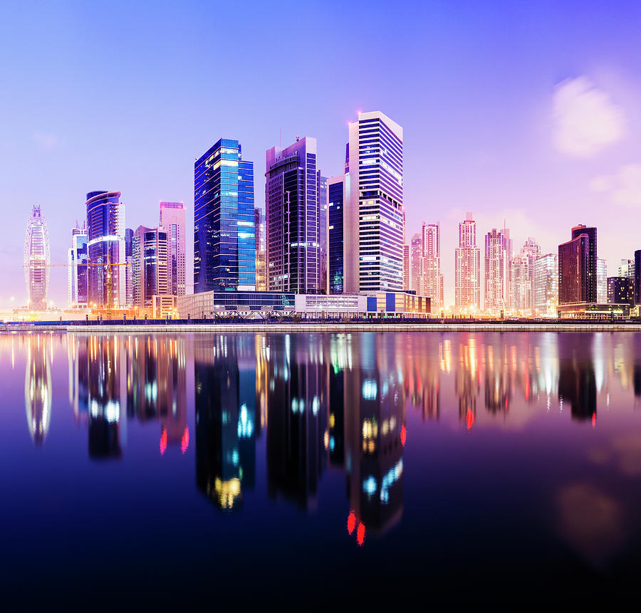 Illuminated Dubai City Skyline At Photograph by Deejpilot