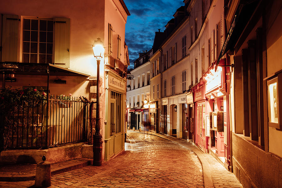 Illuminated streets of Monmartre quarter, street in Paris at night Photograph by Nikada