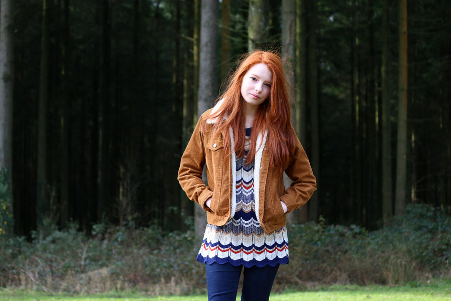 Image of attractive girl, long red hair, hands in pockets Photograph by Mtreasure